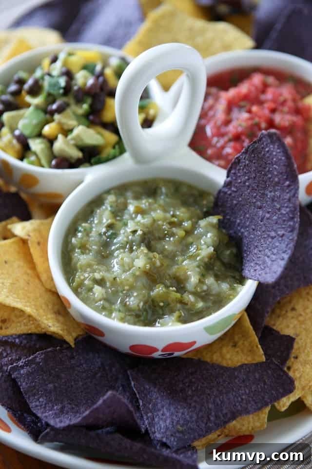 Charred Tomatillo Salsa Verde 2 3 bowl caddy filled with different salsas - fresh tomato salsa, tomatillo salsa and avocado mango salsa