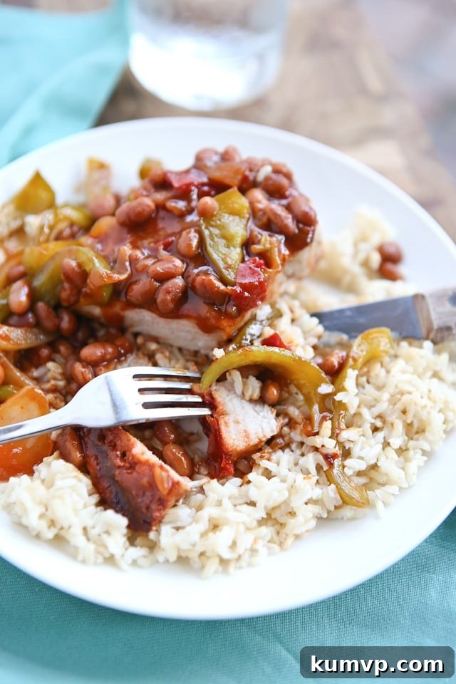 Grilled Pork Chops smothered in a special sauce made with baked beans, peppers and onions. So flavorful and an easy dinner to make - perfect for grilling season!