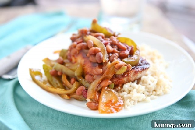 Grilled Pork Chops smothered in a special sauce made with baked beans, peppers and onions. So flavorful and an easy dinner to make - perfect for grilling season!