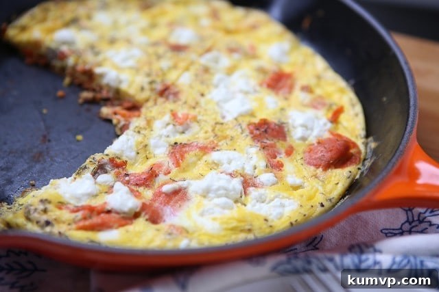 Smoked Salmon Frittata in Skillet A large skillet filled with a freshly cooked Smoked Salmon Frittata, perfectly set and lightly browned.