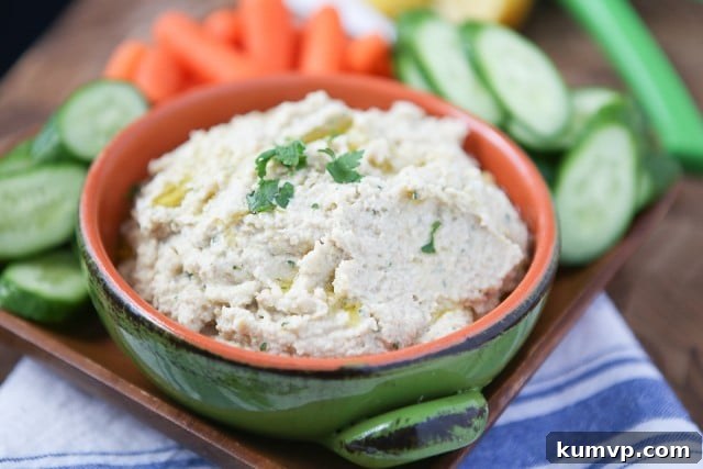 Close-up of creamy Lemony Artichoke Hummus, showcasing its smooth texture and vibrant color.