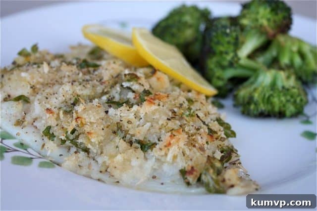 Zesty Oregano Baked Fish 2 breaded and herbed fish on a plate with lemon