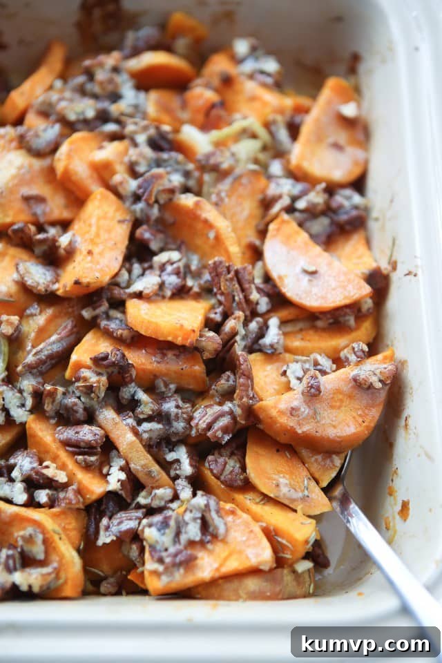 Delicious Savory Sweet Potato Gratin with golden brown topping and chopped pecans, ready to serve.