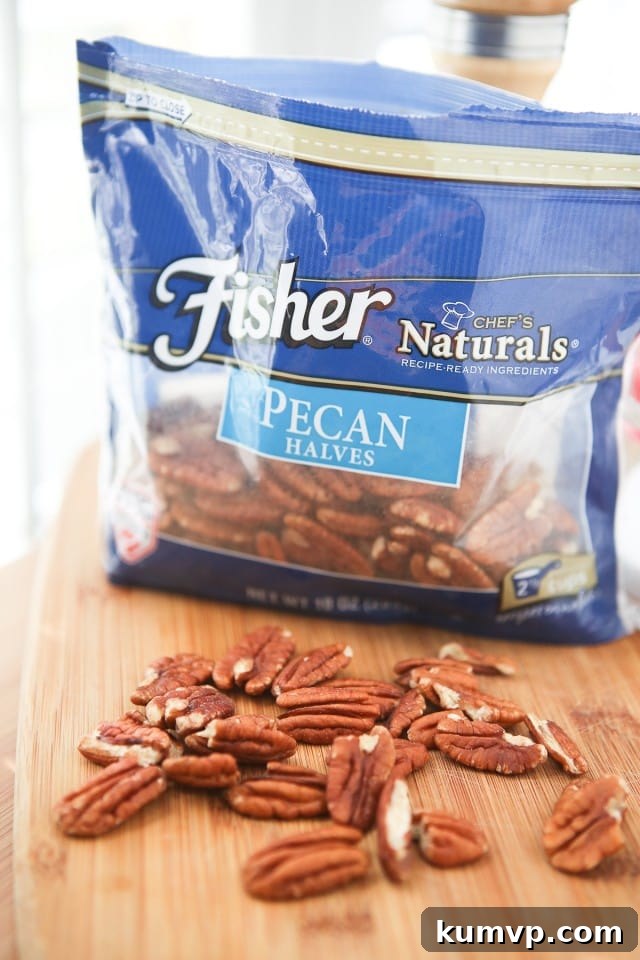 Overhead view of the Savory Sweet Potato Gratin baking dish, showing layered potatoes and pecans.