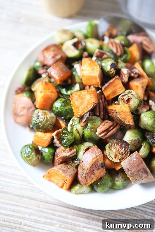 Flavorful Roasted Sweet Potatoes and Brussels Sprouts with Pecans - a popular Aggie's Kitchen side dish