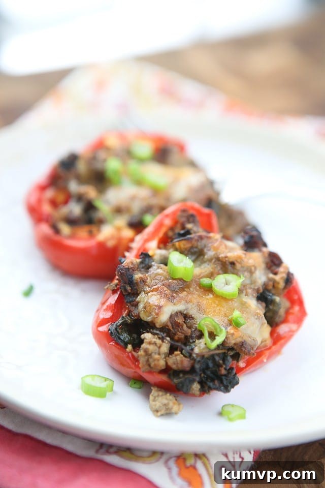 Simple and healthy, this low carb recipe for Beef and Spinach Stuffed Peppers were a hit at my house! 