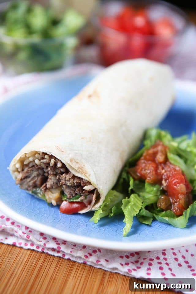 Delicious Turkey and Black Bean Burritos served on a plate with fresh lettuce and vibrant salsa, ready to enjoy