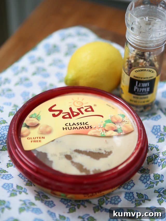 Zesty Lemon Pepper Hummus Garden Platter with Sabra Coupon 3 In need of an easy appetizer? Everyone loves a veggie plate! Spruce it up by serving fresh veggies with semi-homemade Lemon Pepper Hummus. Recipe via aggieskitchen.com #UnofficalMeal #NationalHummusDay