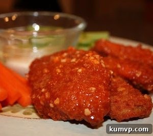 A plate of golden-brown baked boneless chicken wings ready to be tossed in sauce.