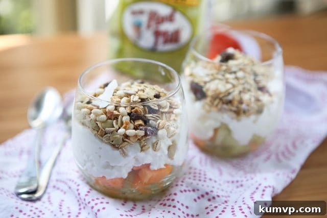 Sunny Melon Power Parfait 3 A top-down shot of two Summer Melon Protein Parfaits in glasses, showcasing the layers of melon, cottage cheese, and muesli, ready to be enjoyed.