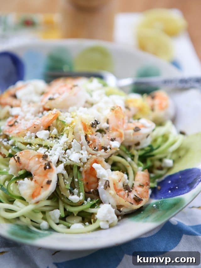 Skinnytaste Zoodles with Shrimp and Feta: A 15-Minute Healthy Meal A vibrant bowl of zucchini noodles generously topped with perfectly cooked shrimp and crumbled feta cheese, garnished with fresh herbs.