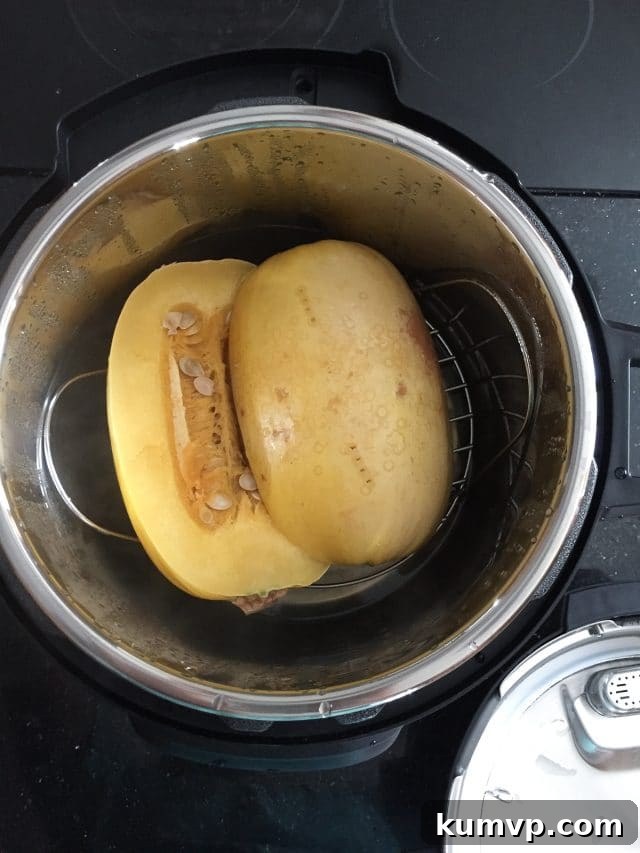 How To Cook Spaghetti Squash in the Instant Pot two spaghetti halves in bowl of instant pot before cooking