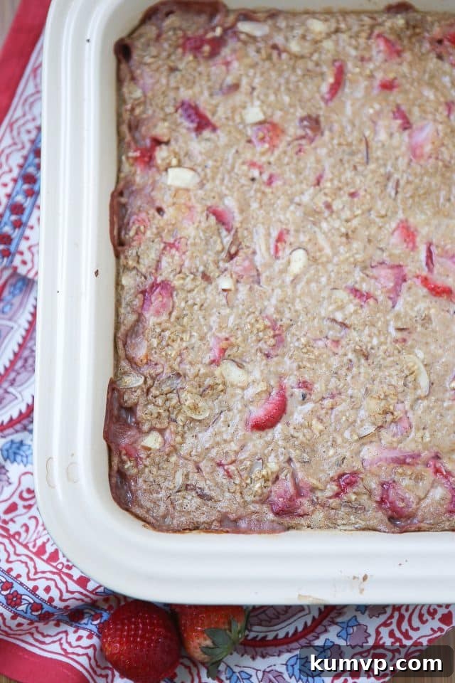 Delicious Strawberry Almond Baked Steel Cut Oatmeal, great for breakfast meal prep or feeding a crowd