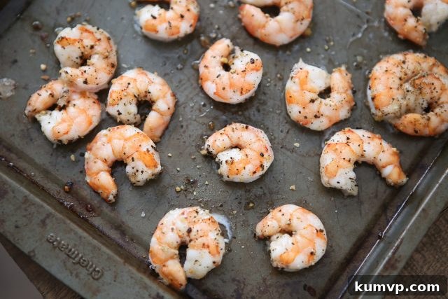 cooked shrimp on a baking sheet