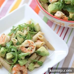 Roasted lemon pepper shrimp tossed with whole wheat pasta, plenty of creamy avocado, arugula, lemon and Parmesan - this Shrimp & Avocado Pasta is a heart-healthy dinner option perfect for any night of the week. Recipe via aggieskitchen.com