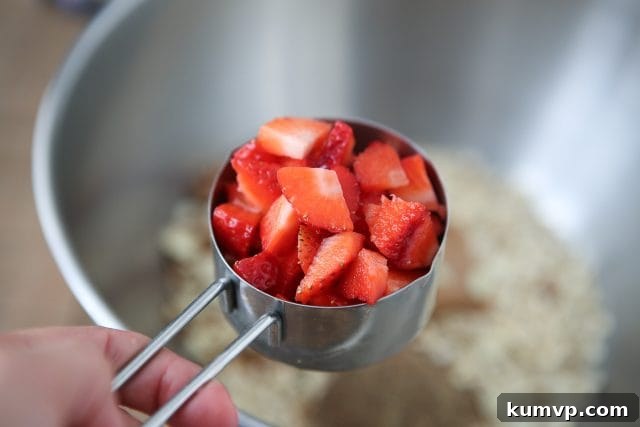 Close-up of freshly baked Strawberry Almond Oatmeal Bites, showcasing texture and ingredients. Recipe via aggieskitchen.com #ThinkFisher