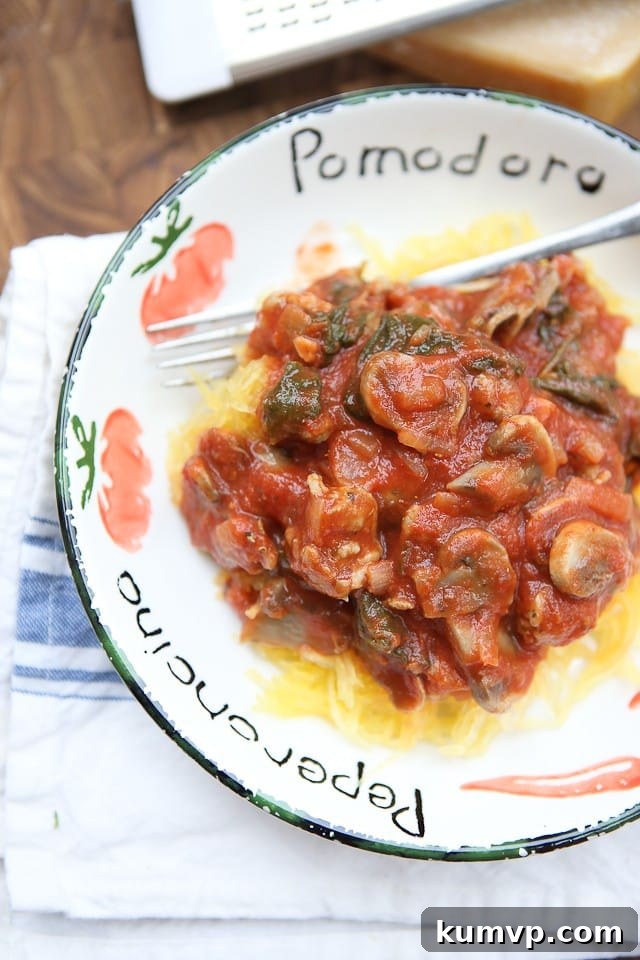 A hearty low carb meal full of flavor! If you haven't tried spaghetti squash, this is the recipe to start with! Delicious spaghetti squash with sausage and mushroom bolognese.