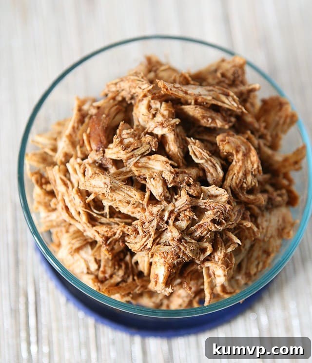 Make a weekly batch of this Slow Cooker Shredded Barbecue Chicken recipe - so many ways to use it in meals! Ideal for meal prep, sandwiches, salads, and more.
