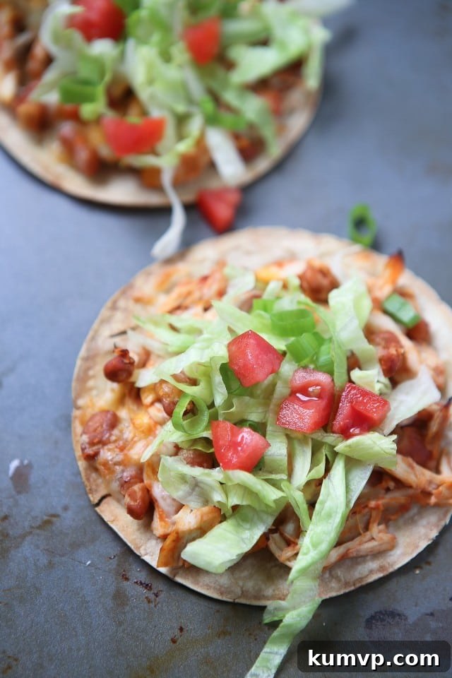 Simple Salsa Chicken and Bean Tostadas - my family loves this dinner and it's a perfect recipe for any night of the week! This healthy and easy meal is customizable with fresh toppings.