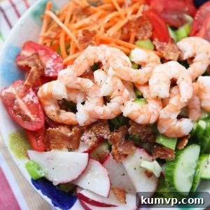 This Garden Salad with Shrimp and Bacon will definitely get you back in the salad! It's is chock full of the best crunchy, colorful veggies plus protein to fill you up and keep you feeling good.