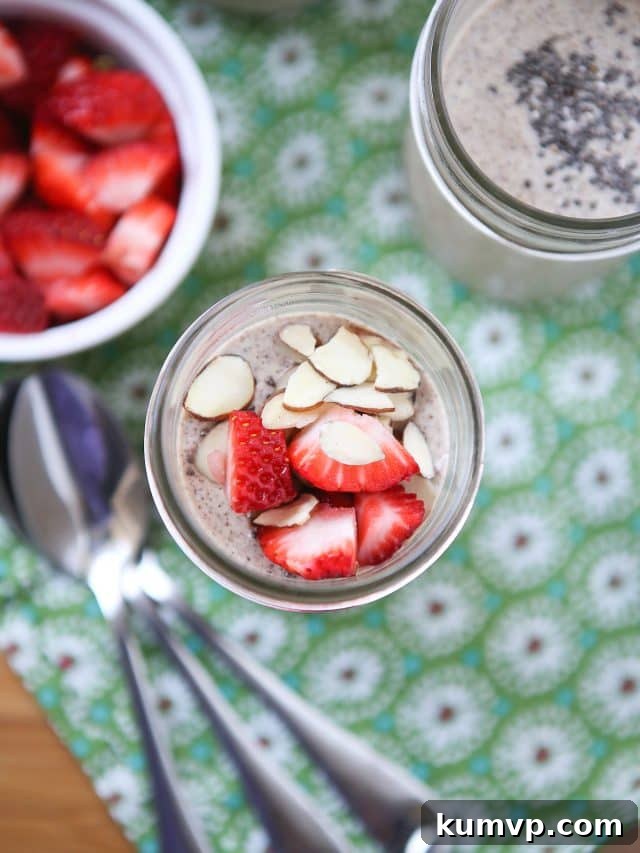 Gourmet Chia Seed Pudding: Serving Suggestions A close-up shot of Cinnamon Peanut Butter Chia Seed Pudding, beautifully garnished with fresh berries and almonds.