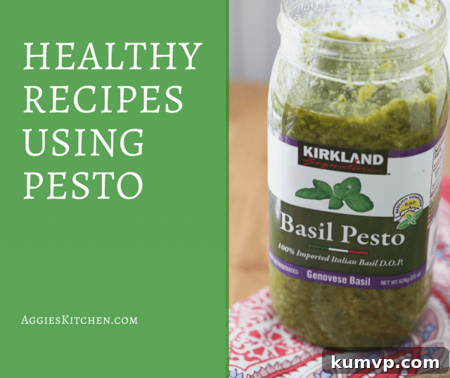 A vibrant bowl of pesto pasta with cherry tomatoes, fresh basil, and a generous dollop of green pesto, ready to be enjoyed.