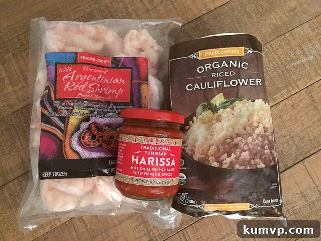 Quick lunch or dinner for one! Cajun Shrimp and Cauliflower Rice Stir Fry - low carb, high protein and full in flavor. A wider shot of the Cajun Shrimp and Cauliflower Rice Stir Fry in a bowl, showcasing the generous portion size perfect for a single, healthy meal.