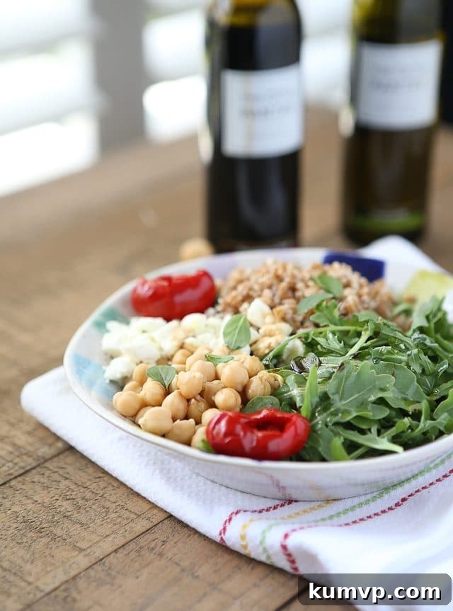 Another enticing shot of the Mediterranean Farro Salad with Arugula & Chickpeas, emphasizing its appeal as a healthy, protein-rich, and fiber-filled vegetarian whole grain meal. Ideal for Meatless Monday. Photo Credit: aggieskitchen.com