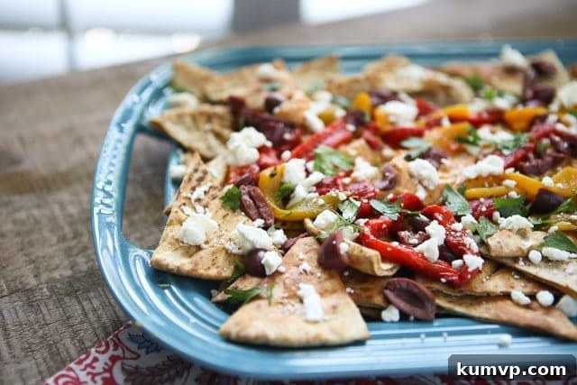 A delectable serving of Mediterranean Nachos, demonstrating the perfect balance of flavors and ingredients, ideal for a casual gathering.