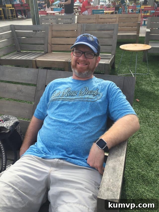 Nightlife at The Hub: Food, Drinks, and Entertainment The lively atmosphere of The Hub on 30A at night, with lights illuminating the various food stalls and gathering areas.