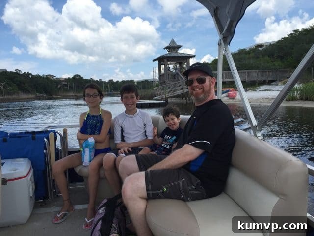 Family Boat Trip: Big Redfish Lake Adventure A family enjoying a scenic pontoon boat ride on Big Redfish Lake, with calm waters and clear skies, part of their daily beach commute.