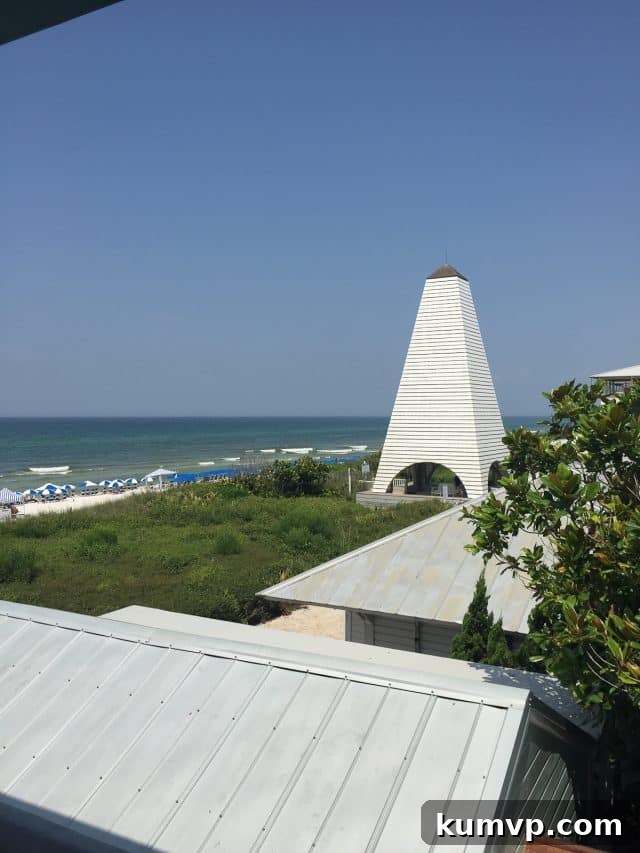Seaside Architecture: Iconic Beach Homes and Coastal Charm Colorful, charming beach houses with distinctive architecture, lining the streets of Seaside, Florida, under a bright blue sky.