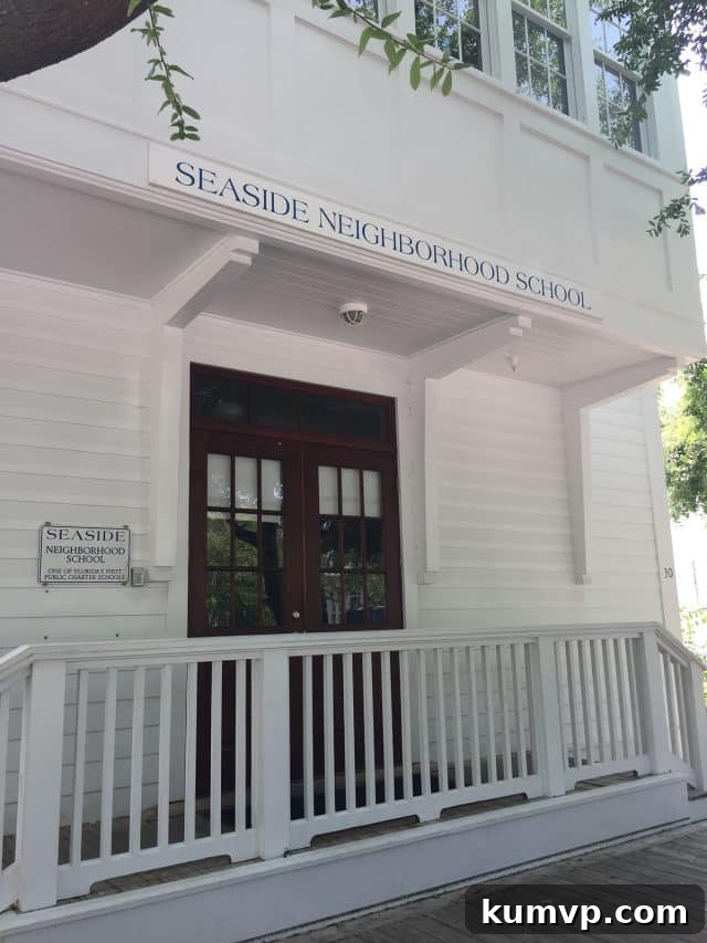 Seaside Entrances: Welcoming Coastal Designs A charming and inviting entrance to one of Seaside's beautifully maintained public spaces or residential areas, surrounded by manicured greenery.