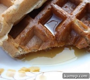 Delicious whole wheat Belgian waffles stacked with syrup