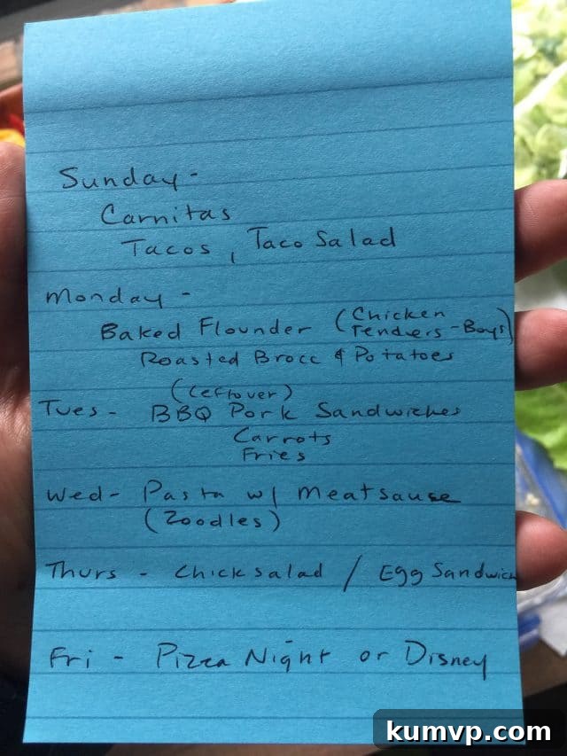 An open refrigerator stocked with colorful, prepped vegetables and fruits in clear containers.