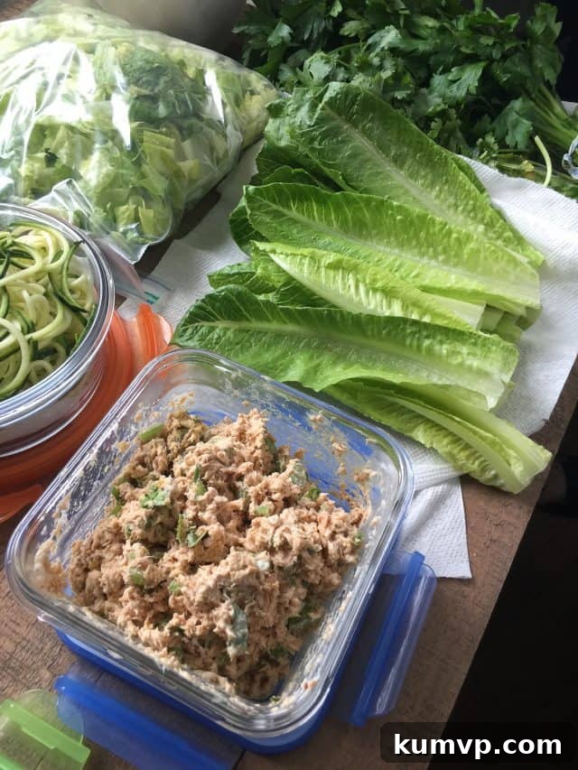 A colorful meal prep guide taped inside a pantry door, featuring themed dinner ideas.