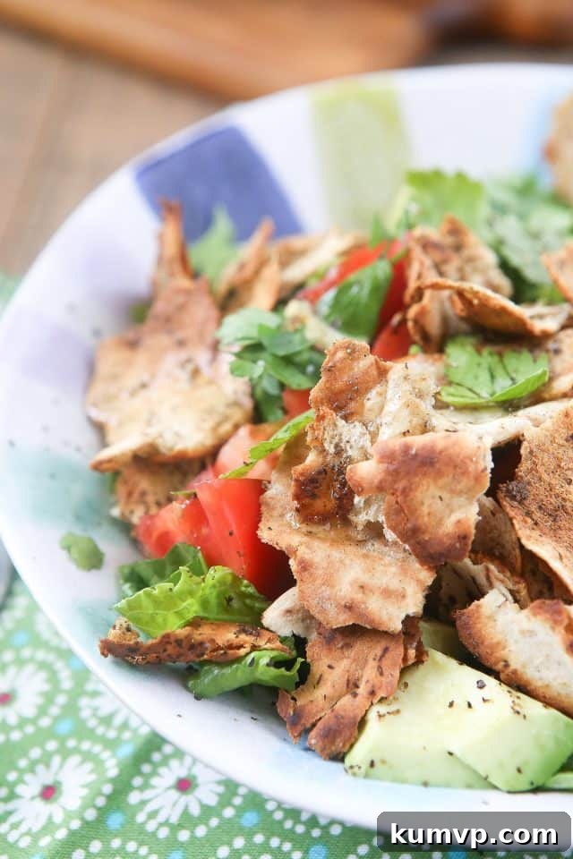 Golden-crisp toasted pita, ready to add the signature crunch to a fresh Fattoush Salad Close-up of golden-brown toasted pita bread pieces, a key crunchy element in Fattoush Salad
