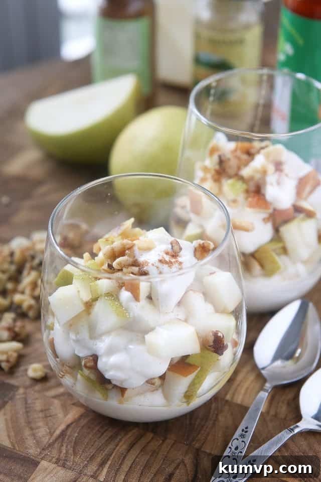 Enjoy the flavors of fall with a Greek Yogurt Parfait with Pears and Walnuts. Layers of creamy Greek yogurt, spiced pears and crunchy walnuts in every bite! Great snack or dessert idea using Greek yogurt. #ad #UndeniablyDairy @DairyGood