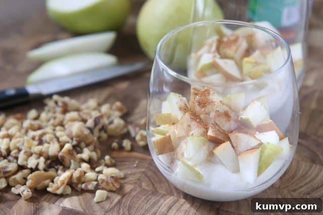 Enjoy the flavors of fall with a Greek Yogurt Parfait with Pears and Walnuts. Layers of creamy Greek yogurt, spiced pears and crunchy walnuts in every bite! Great snack or dessert idea using Greek yogurt. #ad #UndeniablyDairy @DairyGood