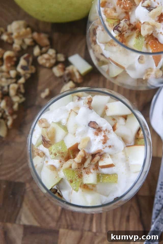 Enjoy the flavors of fall with a Greek Yogurt Parfait with Pears and Walnuts. Layers of creamy Greek yogurt, spiced pears and crunchy walnuts in every bite! Great snack or dessert idea using Greek yogurt. #ad #UndeniablyDairy @DairyGood