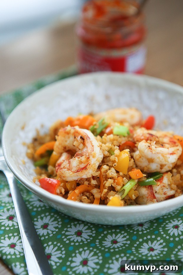 Quick lunch or dinner for one! Cajun Shrimp and Cauliflower Rice Stir Fry - low carb, high protein and full in flavor.