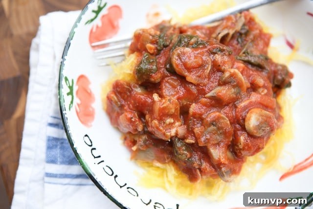 Sun-Drenched Mediterranean Mushroom Bites 8 Hearty Spaghetti Squash with Sausage and Mushroom Bolognese, a comforting and healthy low-carb meal.