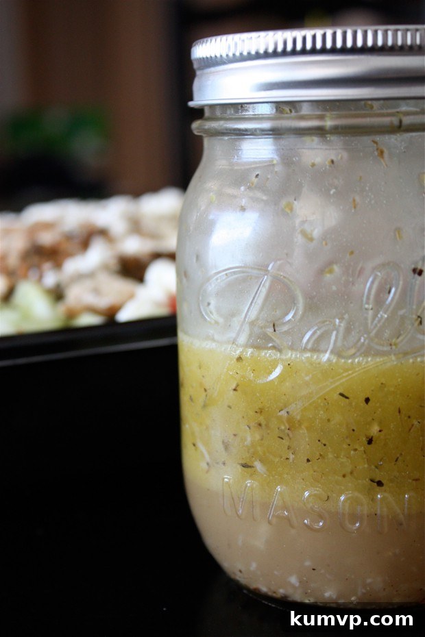 Homemade Greek Salad Dressing A vibrant bowl of fresh Greek Salad topped with delicious homemade Lemon Vinaigrette, showcasing the perfect blend of Mediterranean flavors.