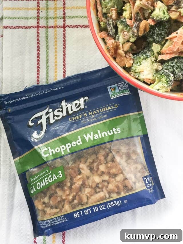 Close-up of Broccoli Raisin Salad showcasing fresh broccoli, sweet raisins, and Fisher walnuts. Close-up of Broccoli Raisin Salad showcasing fresh broccoli, sweet raisins, and Fisher walnuts.