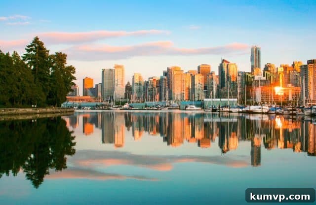 Beautiful view of Vancouver skyline with Stanley Park at sunset, British Columbia, Canada.