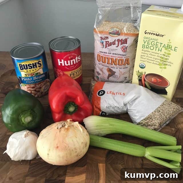 Pressure Cooker Plant Based Chili 4 A close-up of a steaming bowl of Instant Pot Vegetarian Chili, topped generously with freshly shredded cheese, bright green onions, and vibrant cilantro, inviting a delicious first bite.