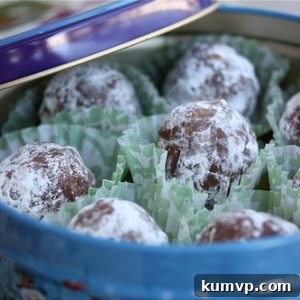 A small image of a cluster of finished bourbon balls, rolled in powdered sugar.