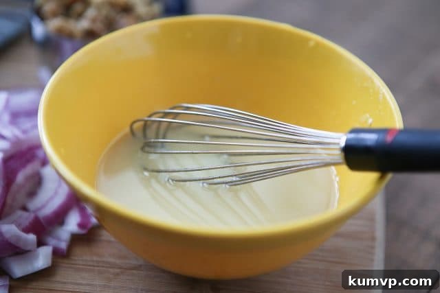 Delicious and Healthy Summer Salad with Feta Close-up of Green Bean Salad with Feta, walnuts, and red onion