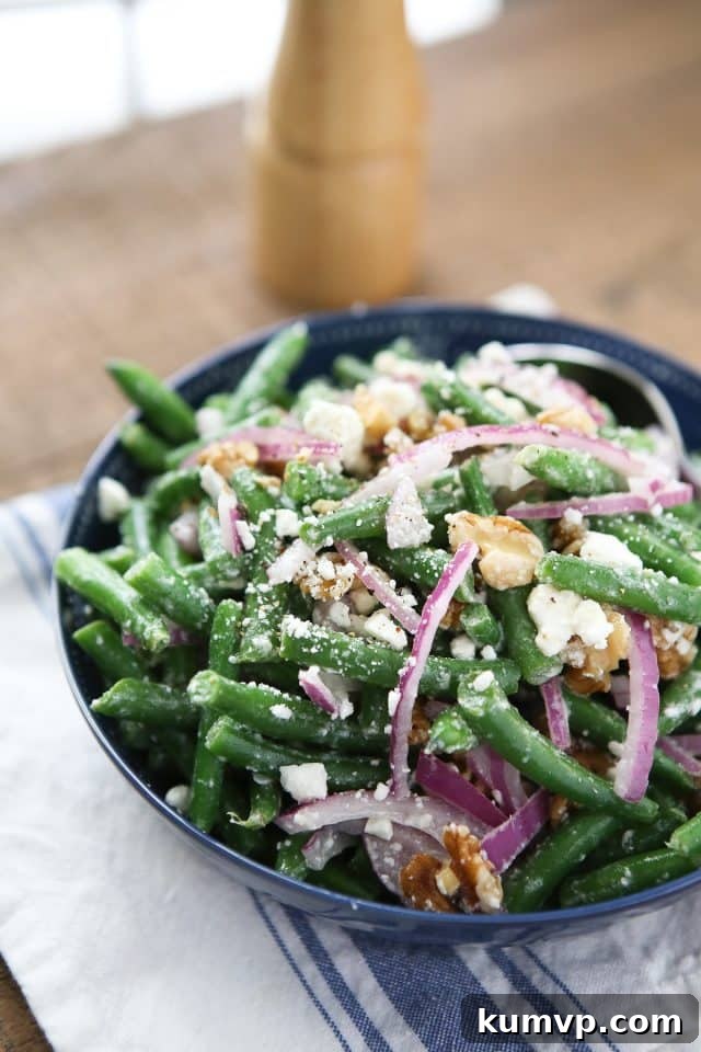 Summer Green Bean Salad with Feta and Lemon Vertical shot of Green Bean Salad with Feta in a serving bowl