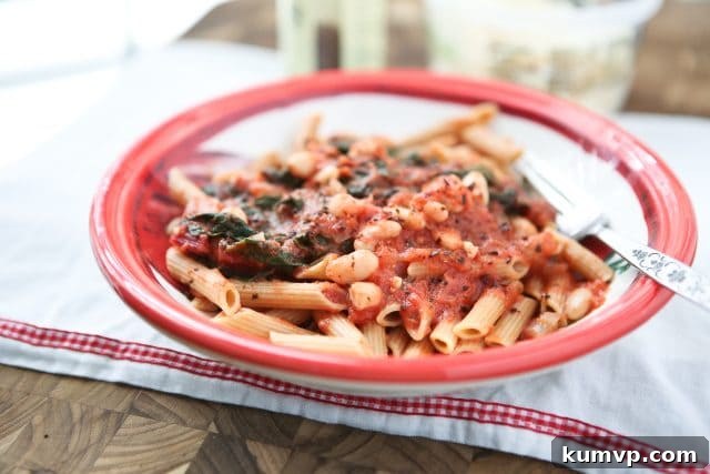 Swiss Chard with White Beans over Pasta - whole wheat pasta, greens and beans make this dish a hearty vegetarian pasta meal! Recipe via aggieskitchen.com
